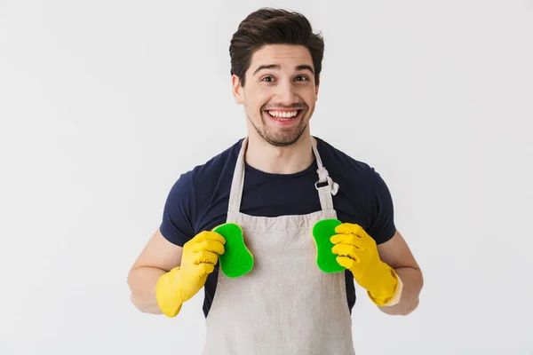 Handsome brunette houseman wearing apron — Stock Photo, Image