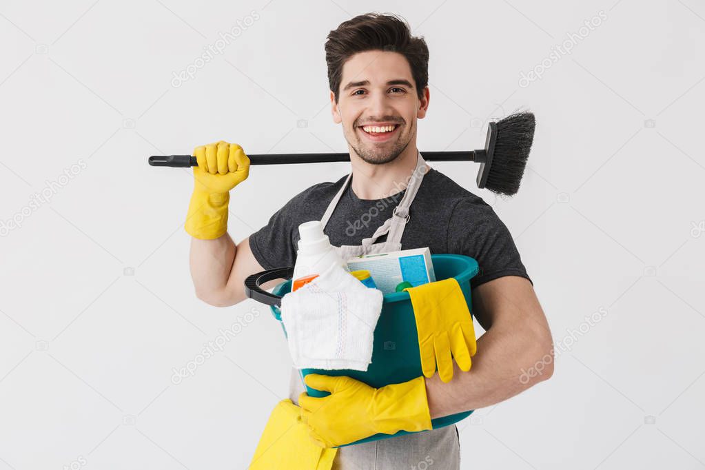 Handsome brunette houseman wearing apron