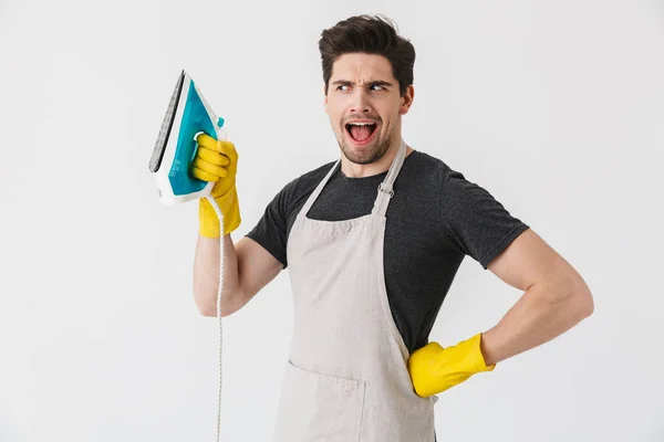 Photo of european young man wearing yellow rubber gloves for han — Stock Photo, Image