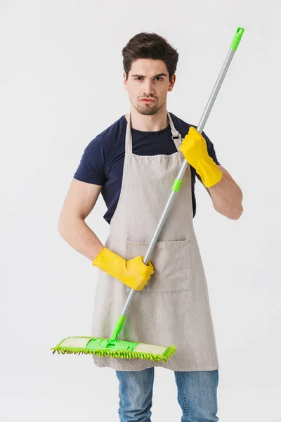 Photo of masculine young man wearing yellow rubber gloves for ha — Stock Photo, Image