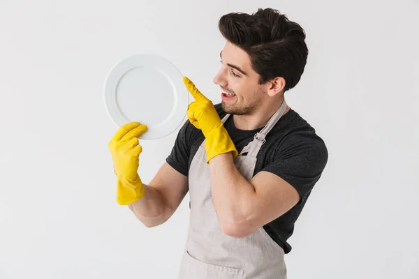Photo of happy young man wearing yellow rubber gloves for hands — Stock Photo, Image