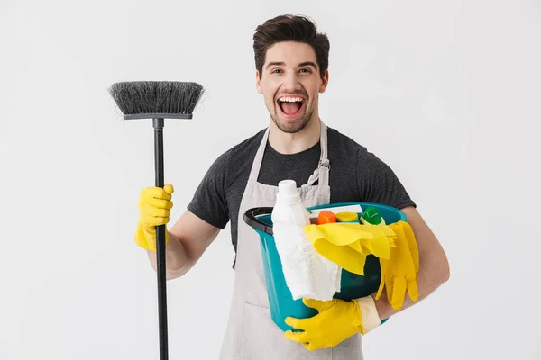 Handsome brunette houseman wearing apron — Stock Photo, Image