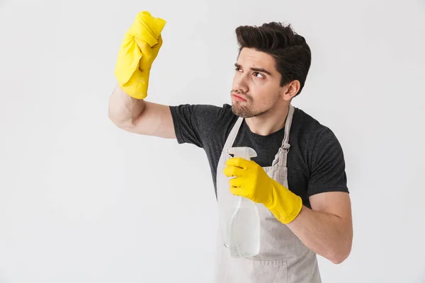 Handsome brunette houseman wearing apron — Stock Photo, Image