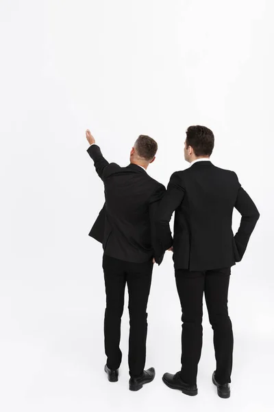 Two attractive confident businessmen wearing suits — Stock Photo, Image