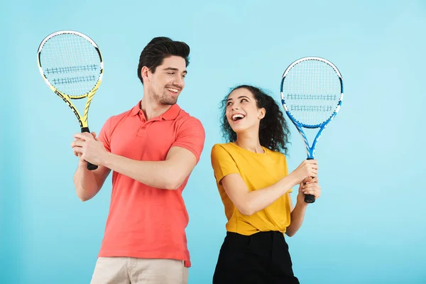 Cheerful young couple standing isolated — Stock Photo, Image