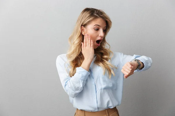 Photo of concerned blond businesswoman with long curly hair worr — Stock Photo, Image