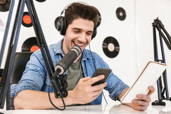 Handsome happy young male radio host broadcasting — Stock Photo, Image