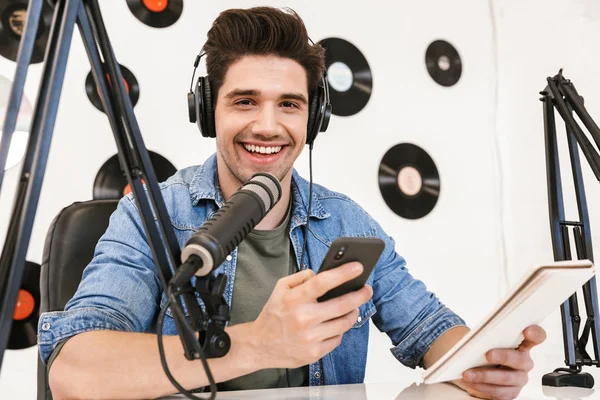 Handsome happy young male radio host broadcasting — Stock Photo, Image