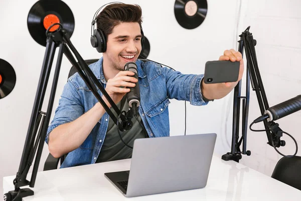 Handsome happy young male radio host broadcasting — Stock Photo, Image