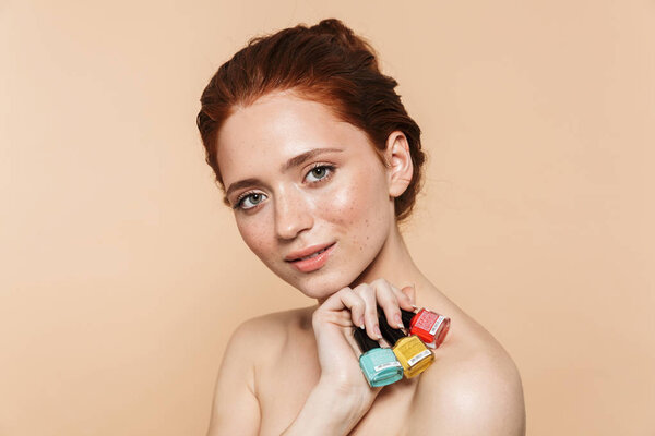 Beauty portrait of an attractive young topless redhead woman