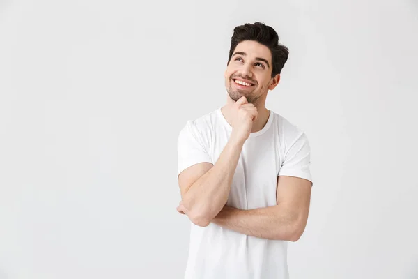 Feliz jovem animado emocional homem posando isolado sobre branco parede fundo . — Fotografia de Stock