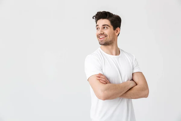 Feliz jovem animado emocional homem posando isolado sobre branco parede fundo . — Fotografia de Stock