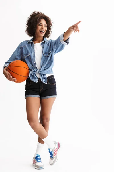 Full length portrait of a young cheerful african woman — Stock Photo, Image