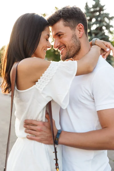 Portrait of romantic young couple looking at each other and hugg — Stock Photo, Image