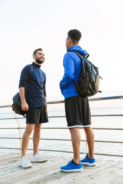 Two attractive young healthy sportsmen outdoors