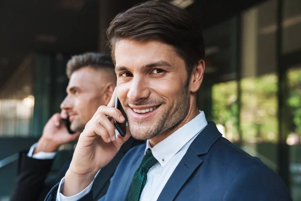 Image of happy businessmen partners standing outside office cent — Stock Photo, Image