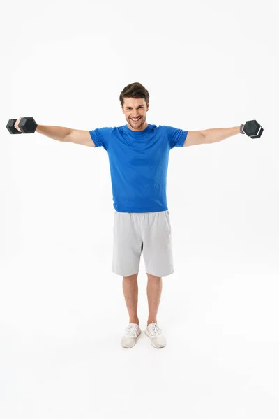 Full length photo of happy sportsman in shorts and t-shirt lifti — Stock Photo, Image