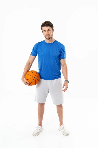 Attractive young fit sportsman wearing t-shirt standing — Stock Photo, Image