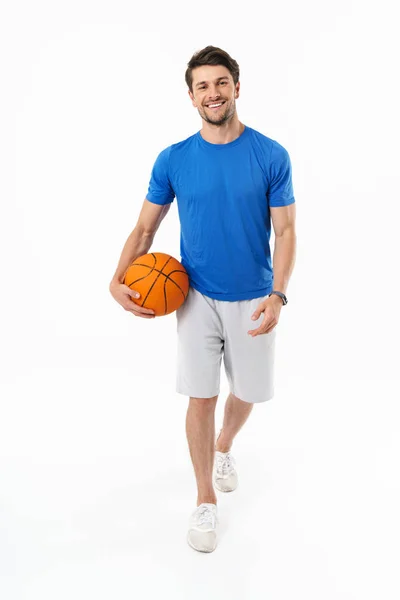 Attractive young fit sportsman wearing t-shirt standing — Stock Photo, Image