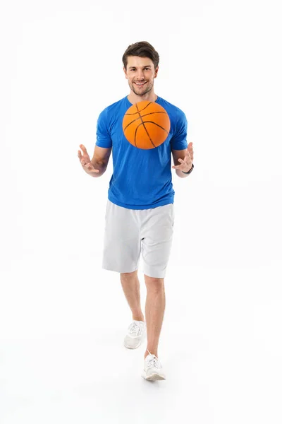 Attractive young fit sportsman wearing t-shirt standing — Stock Photo, Image