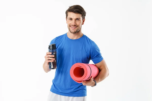 Photo of handsome man wearing casual t-shirt smiling while carry — Stock Photo, Image