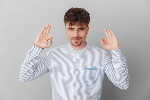 Portrait of masculine curly man dressed in shirt smiling on came — Stock Photo, Image