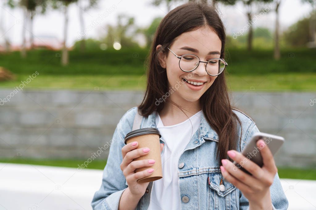 Stock Photo Of Young Pretty Busty Girl Walk Outdoors With Smart Phone Slide Game App Pokemon Go