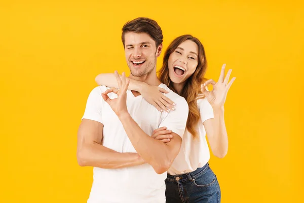 Portrait of beautiful couple in basic t-shirts standing together — Stock Photo, Image