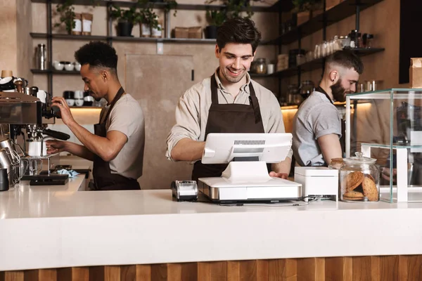 Happy coffee men colleagues in cafe bar working indoors. — Stock Photo, Image