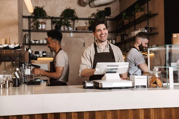Happy coffee men colleagues in cafe bar working indoors. — Stock Photo, Image