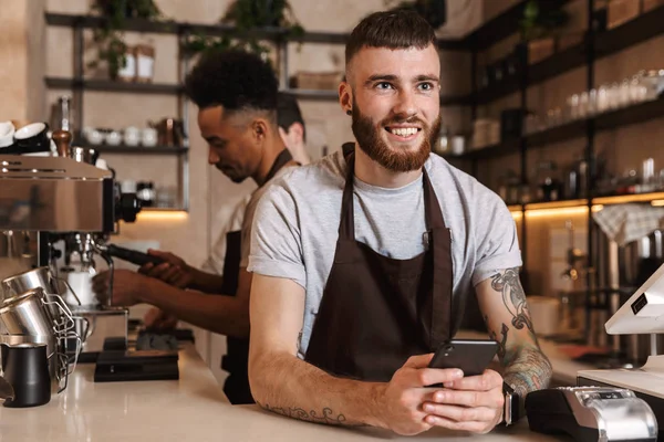 Happy coffee men colleagues in cafe bar working indoors. — Stock Photo, Image