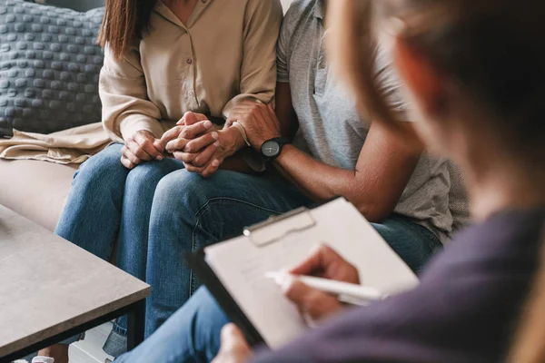 Cropped photo of casual nice couple having conversation with psychologist on therapy session in room — Stock Photo, Image