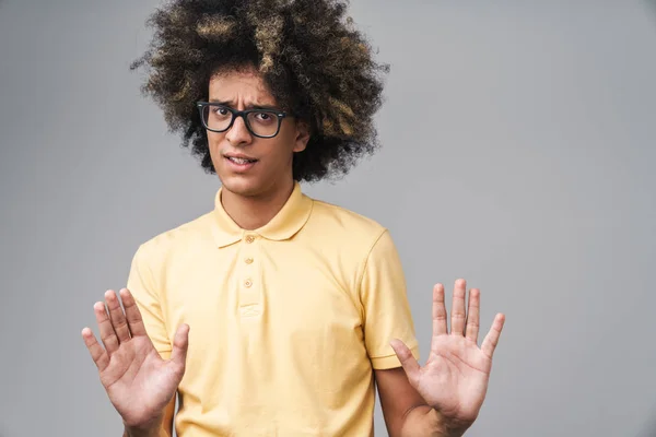 Photo of anxious caucasian man with afro hairstyle gesturing sto — Stock Photo, Image