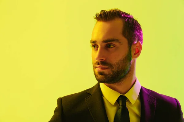 Image of serious young businessman in formal suit posing at camera — Stock Photo, Image