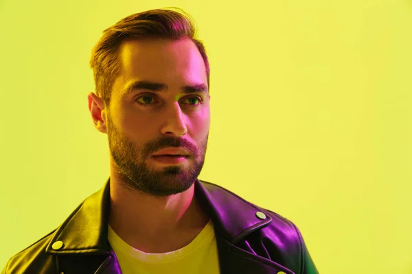 Attractive young man wearing leather jacket