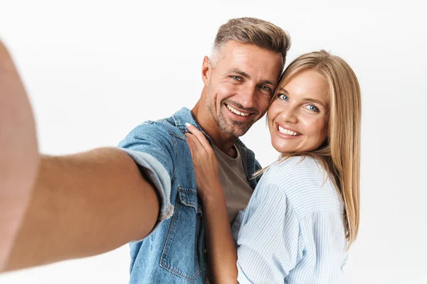 Portrait of pleased caucasian couple man and woman in basic clot — Stock Photo, Image