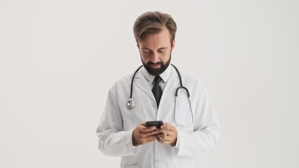 Attractive Young Bearded Man Doctor White Professional Coat Stethoscope Smiling — Stock Video