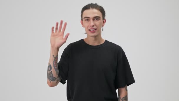 Cheerful Young Tattooed Brunette Man Black Shirt Smiling Waving Hand — Stock video