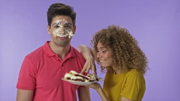 Cheerful Young Woman Putting Birthday Cake Her Boyfriend Face Happy — Stock Video