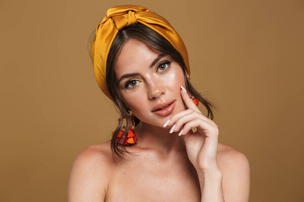 Close up beauty portrait of an attractive young topless woman