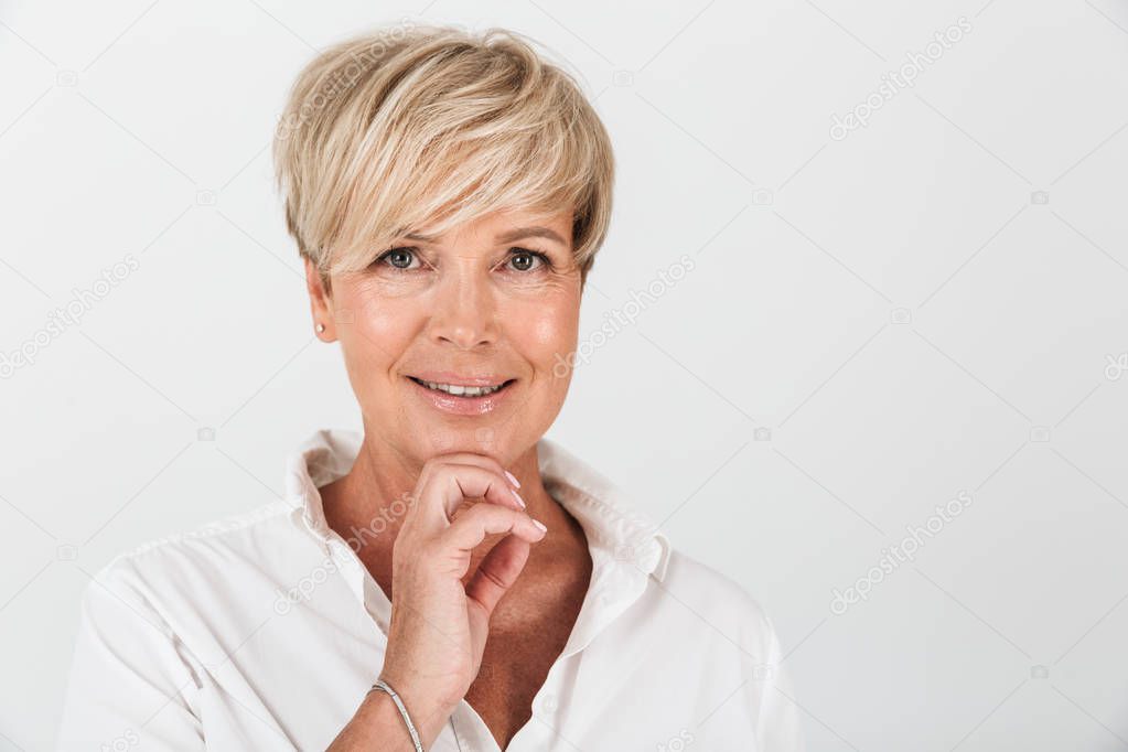 Portrait closeup of joyous adult woman with short blond hair smi