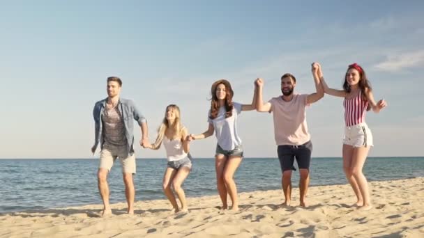 Group Young Cheerful Friends Smiling Jumping Together While Having Fun Royalty Free Stock Footage