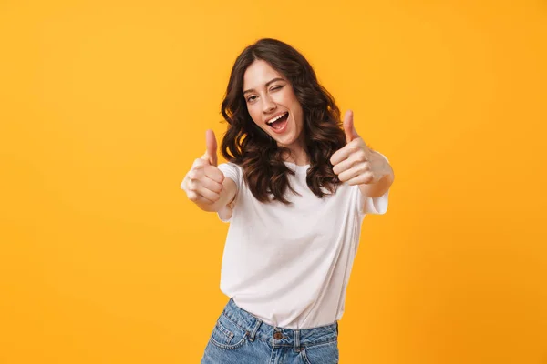 Image of beautiful brunette woman wearing casual clothes winking — Stock fotografie