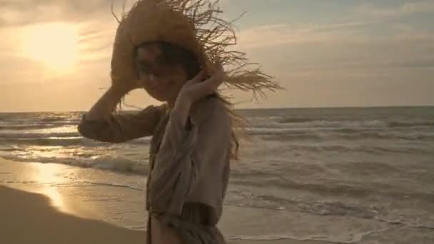 Happy Attractive Young Woman Holding Her Straw Hat Enjoying Breeze — Stock Video