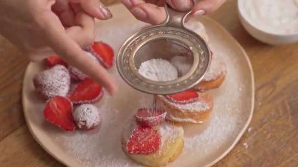 Cropped View Young Woman Sprinkling Pancakes Powdered Sugar Using Sieve — Stock Video