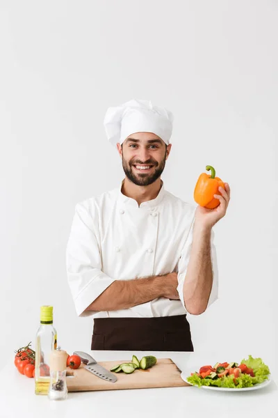 Bild av ung hövding i uniform innehav söt papper medan co — Stockfoto