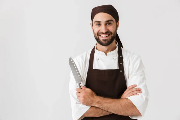 Image of happy chief man in cook uniform smiling and holding big — Stock Photo, Image