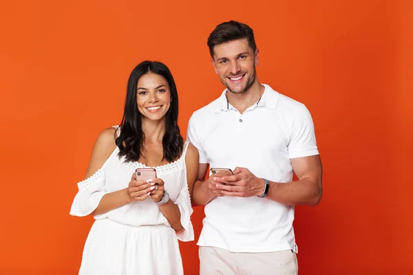 Attractive young couple standing isolated