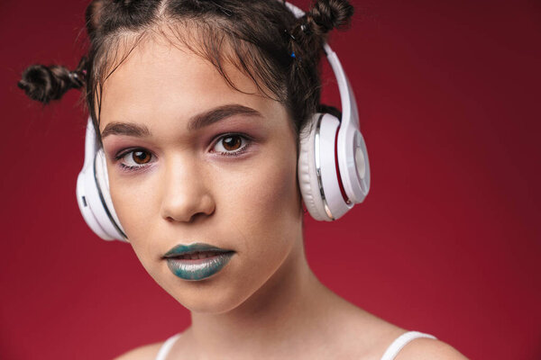 Image closeup of teenage punk girl with bizarre hairstyle and da