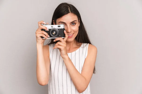 Image of young brunette woman wearing dress smiling and taking p — Stock Photo, Image